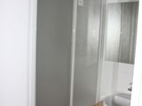 a bathroom with a sink and a shower in it