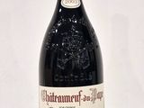 a bottle of wine that is sitting on a table