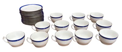 a lot of cups and a stack of plates on the table