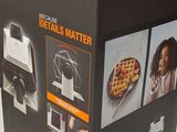 a box with a picture of a waffle maker inside of it