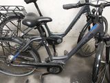 many bicycles that are parked next to each other