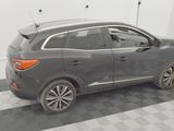 a picture of a grey car parked in a garage