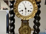 a clock that is sitting on a table in a room
