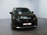 a black car that is parked in a showroom
