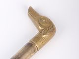 an old cane with a wooden handle on a white surface