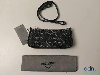 a close up of a purse with a lanyard and a lanyard strap