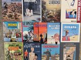 a lot of books that are sitting on the floor