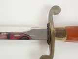 a knife with a handle on a white surface