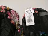 the back of a bra top with a price tag attached to it