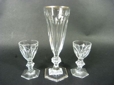 three pieces of glass sitting on a black surface