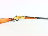 a rifle with a wooden barrel and a wooden handle on a white surface