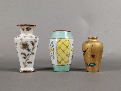 three vases sitting next to each other on a table