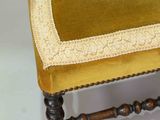 an image of a chair with a yellow cushion on top of it