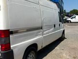 a white van that is parked in a parking lot