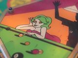 a close up of a skateboard with a cartoon on it