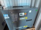 a close up of a machine on a pallet in front of a building