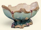 a blue and white bowl with pink flowers on it