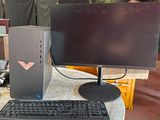a desktop computer sitting on a table with a keyboard and monitor