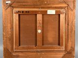 an old wooden picture frame with a picture of a bird on it
