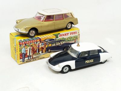 a toy car and a toy police car on a white surface
