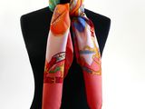 a close up of a woman wearing a scarf on a mannequin