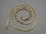 a gold chain with a clasp and a clasp