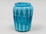 a blue vase that is sitting on a table