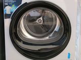 the front view of a washing machine with its door open