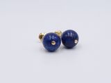 pair of lapis stone stud earrings on a white background