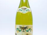 a bottle of wine that is sitting on a table