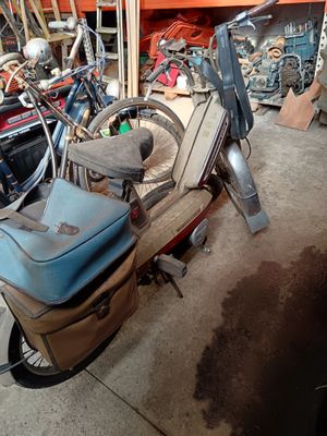 a scooter that is parked in a garage