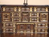 a large wooden chest with many drawers on it