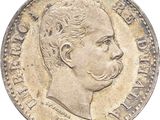 a close up of a coin with a man ' s face on it