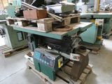 a machine that is sitting on a pallet in a warehouse