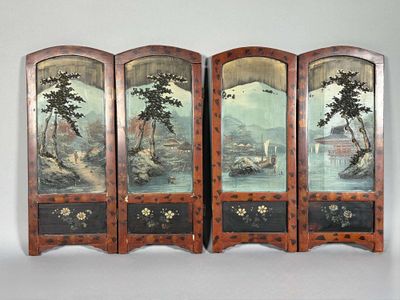 three panels with asian paintings on them on a white wall
