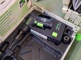 a box with a cordless drill in it on the floor
