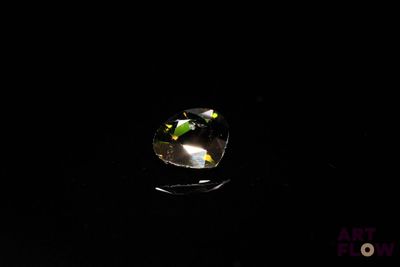 an image of a close up of a mirror in the dark
