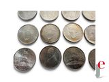 an image of a bunch of coins sitting on top of a white surface