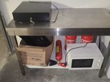 a microwave and a microwave oven on a stainless steel table