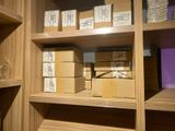 many boxes on the shelves in the room