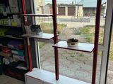 a shelf that has a mirror on top of it