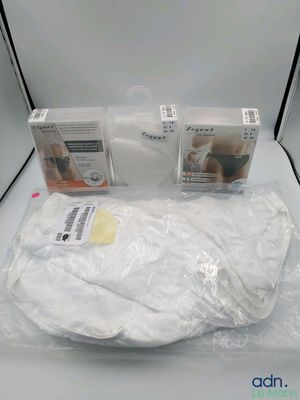 three boxes of baby products sitting on a white table