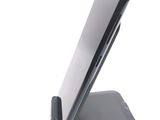 a cell phone that is sitting on top of a stand