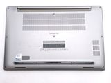 a laptop that is sitting on a white surface
