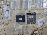 a room with a lot of electronics on the shelves