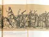 un livre ouvert sur lequel figure le dessin d'un groupe de personnes