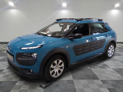 the blue citrole is parked in the garage on a checkered floor