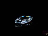 a close up of a diamond on a black surface