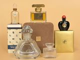many different types of perfume bottles on the table