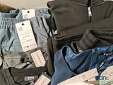 a pile of clothing that is sitting on a table